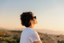 Tomboy Woman Enjoying A Sunset In The Moroccan Desert.