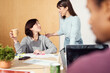 © Guille Faingold/Stocksy - Warm Office Interaction