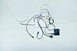© Colour Laboratory/Stocksy - Wires, chargers and cords on a business office floor with flashlight