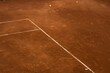 © Oleksandr Stalovierov/Stocksy - Tennis court with balls and lines.