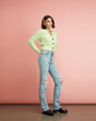 © A Model Photographer/Stocksy - A woman in a stylish outfit standing in a studio