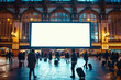 © Robert Kneschke - Blank billboard at a bustling train station with commuters carrying luggage