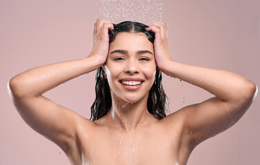 Wall Mural - Portrait, cleaning and woman with water splash, beauty and dermatology on studio background. Face, person and model with liquid, washing and shower with hygiene, habit and wet with grooming routine