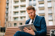 © Studio Firma/Stocksy - Businessman sitting on bench