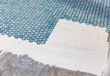 © Raymond Forbes LLC/Stocksy - Tile floor Construction in Residential Home Improvement with grout