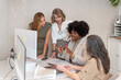 © Bisual Studio/Stocksy - Cheerful diverse women working on project in office