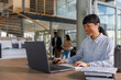 © Jovo Jovanovic/Stocksy - Confident businesswoman using laptop at desk in office