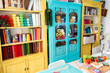 © nomad studio/Stocksy - Colorful craft room with fabric and yarn storage