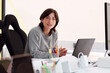 © Guille Faingold/Stocksy - Confident Professional at Her Workspace
