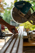© Raymond Forbes LLC/Stocksy - Construction Carpenter cutting wood with saw