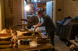 © Raymond Forbes LLC/Stocksy - Construction Carpenter job cutting wood with saw home rernovation