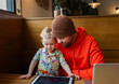 © Bethany Birnie/Stocksy - Father and Son cafe moment