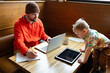 © Bethany Birnie/Stocksy - Singe Parent Freelancer at Cafe