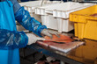© Luis Herrera/Stocksy - man working in fish indusrty