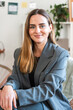 © nomad studio/Stocksy - Professional Woman Smiling in Office