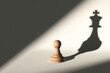 © Andbiz - A chess pawn from which the shadow of the king falls. Space for text.