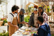© BONNINSTUDIO/Stocksy - Diverse friends having lunch in community garden