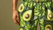 © MiguelAngel - A person with a fun and original swimsuit, with avocados printed on it.