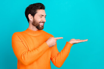 Poster - Photo of cheerful nice man wear orange trendy clothes introduce empty space isolated on cyan color background