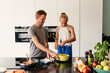 © Melissa Milis Photography/Stocksy - Daughter and parent whisking eggs