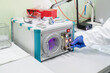 © Hernandez & Sorokina/Stocksy - Researcher Using Plasma Surface Treatment Machine