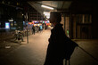 © Irina Efremova/Stocksy - Silhouette of person walking in city night