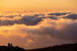 © Tim Booth/Stocksy - A group of hikers above the cloud