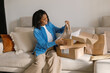 © Artem Podrez/Stocksy - Woman Online Shopping Unboxing at Home