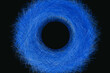 © Marcos Osorio/Stocksy - Blue object on black background