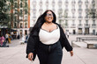 © Santi Nuñez/Stocksy - Happy and empowered plus size woman