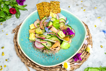 Wall Mural - a plate topped with salad next to some flowers and rice