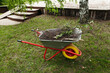 © Irina Polonina/Stocksy - Garden Clean-Up With Wheelbarrow and Debris