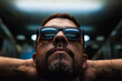 © Ana Luz Crespi/Stocksy - Man portrait in elevator with sunglasses