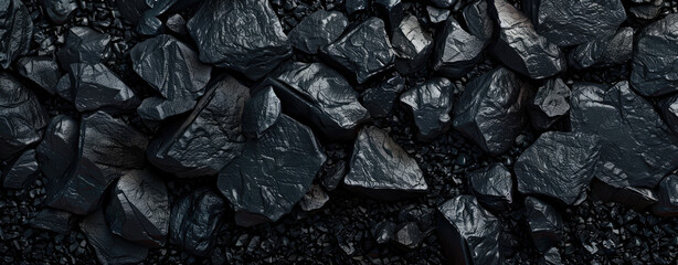 Coal texture background, panoramic banner with abstract black stones. Concept of mine, industry, charcoal, nature, energy