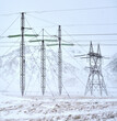 © Adam Sébire/Stocksy - High voltage electricity transmission power line for grid