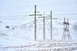 © Adam Sébire/Stocksy - Renewable energy network - electricity transmission power line