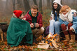 © Studio Firma/Stocksy - Family around campfire