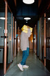 © Sergey Narevskih/Stocksy - Person carrying stack of folders