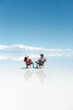 © Luis Herrera/Stocksy - Tourist Couple Relaxing in amazing landscape