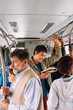 © Studio Firma/Stocksy - Crowded bus