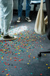 © DZ FILM/Stocksy - Men stand on the floor covered with confetti