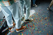 © DZ FILM/Stocksy - Men stand on the floor covered with confetti