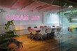 © VICTOR TORRES/Stocksy - Modern office interior with motivational neon sign