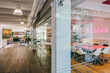 © VICTOR TORRES/Stocksy - Modern office interior with vibrant Dream neon sign
