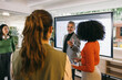 © VICTOR TORRES/Stocksy - Business leader presenting to colleagues during a meeting