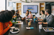 © VICTOR TORRES/Stocksy - Diverse team in a business meeting with presentation