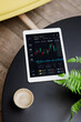 © VICTOR TORRES/Stocksy - Digital Tablet with Market Analytics