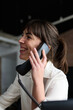 © Guille Faingold/Stocksy - Woman smiling talking on phone