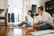© Pedro Merino/Stocksy - Women working together to assemble furniture at home