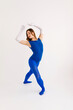 © Tania Cervian/Stocksy - Ballerina in blue leotard practicing ballet dance steps during class